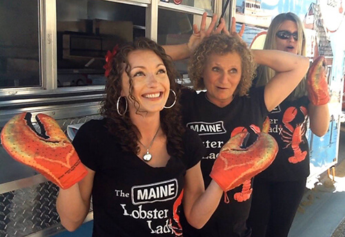 Diana, aka The Maine Lobster Lady, and Lobsterettes acting silly on The Maine Lobster Lady food truck